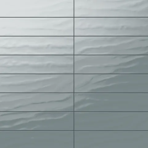 Palmer 6x24 glossy porcelain tile in Eucalyptus, showcasing a wavy textured surface and a rich greenish hue.