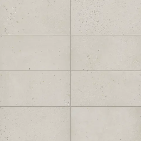 Sloane 12x24 matte porcelain tile in Pearl, featuring a light, speckled finish for a clean and airy aesthetic, perfect for contemporary spaces.