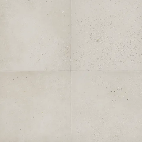 Sloane 24x24 matte porcelain tile in Pearl, showcasing a light neutral finish with delicate speckling, perfect for creating bright, open spaces.