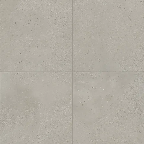 Sloane 24x24 matte porcelain tile in Sandstone, offering a soft beige tone with refined speckling, perfect for creating warm and inviting spaces.