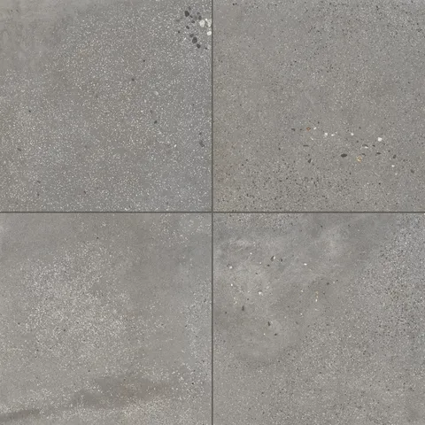 Sloane 24x24 matte porcelain tile in Pebble, featuring a mid-gray hue with dynamic speckling, ideal for adding subtle texture to contemporary designs.