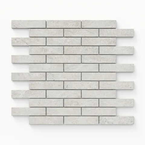 Dawson 1x4 Matte Porcelain Mosaic Tile in alabaster, showcasing a sleek linear pattern in a light neutral tone.