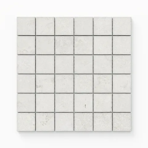 Matte mosaic porcelain tiles arranged in a 2x2 square design, showcasing a natural cross-cut pattern with a delicate soft white tone.
