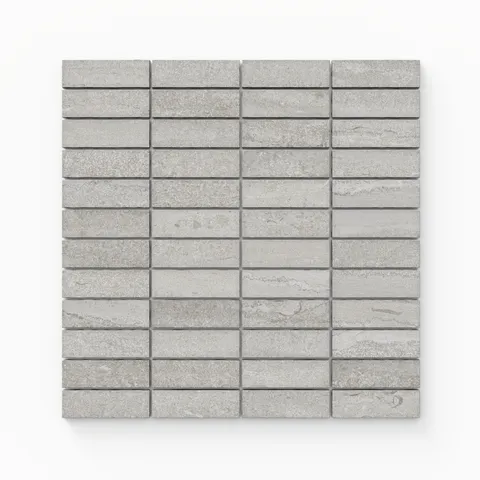 Matte porcelain mosaic tiles in a soft taupe tone, featuring a 1x3 vein-cut design that adds subtle texture and warmth to contemporary spaces.