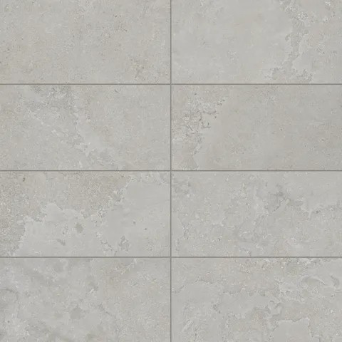 Sophisticated 12x24 matte porcelain tile in a soft taupe shade with cross-cut detailing, offering a natural stone-inspired look for versatile designs.