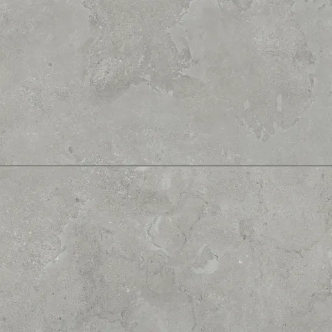 Large-format matte porcelain tiles in a soft ash grey tone, featuring intricate cross-cut patterns for a refined, natural stone appearance.