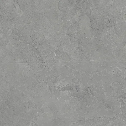 Large matte porcelain tiles in deep gray, boasting intricate cross-cut patterns that evoke a raw, natural stone texture.
