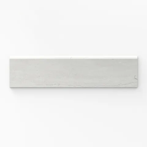 Bullnose porcelain tile with a matte finish, featuring a soft white tone, 3x12 trim size, and elegant vein-cut texture for seamless edge detailing.