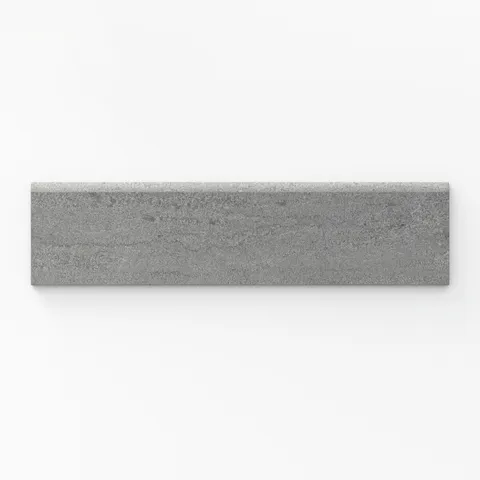 Bullnose porcelain tile in bold grey tone with a matte finish, featuring a 3x12 trim and vein-cut texture, perfect for seamless edges.
