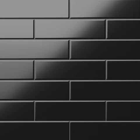 Polly Black 3x10 satin ceramic tiles showcase a sleek, matte finish with deep black tones, perfect for adding bold sophistication to contemporary spaces.