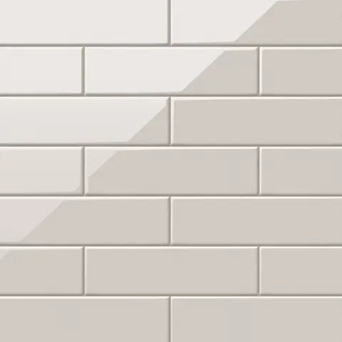 Polly Beige 3x10 glossy ceramic tiles showcasing a sleek, neutral tone with a reflective finish, perfect for creating timeless and sophisticated interiors.