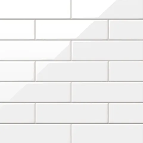 Polly White 3x10 glossy ceramic tiles feature a crisp, clean aesthetic with a brilliant reflective finish, ideal for modern and timeless spaces alike.