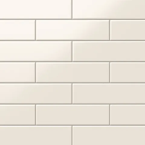 Polly Cream 3x10 satin ceramic tiles offer a soft, matte finish in a warm neutral hue, ideal for creating a serene and timeless aesthetic.