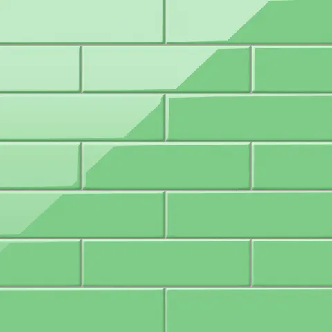 Polly Green 3x10 glossy ceramic tiles bring a vibrant pop of color with their sleek, reflective finish, perfect for bold backsplashes or lively feature walls.