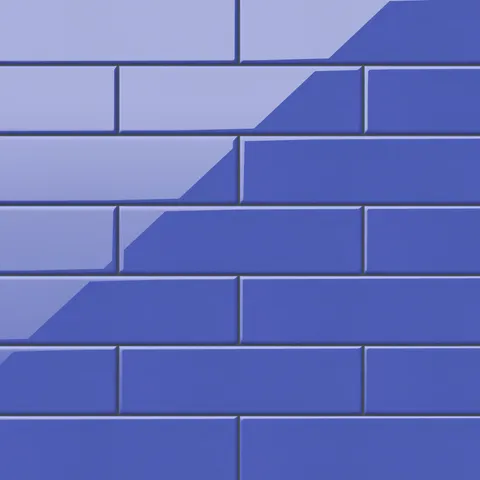 Polly Periwinkle 3x10 glossy ceramic tiles bring a playful yet refined touch with their vibrant blue hue and reflective finish, perfect for bold modern spaces.