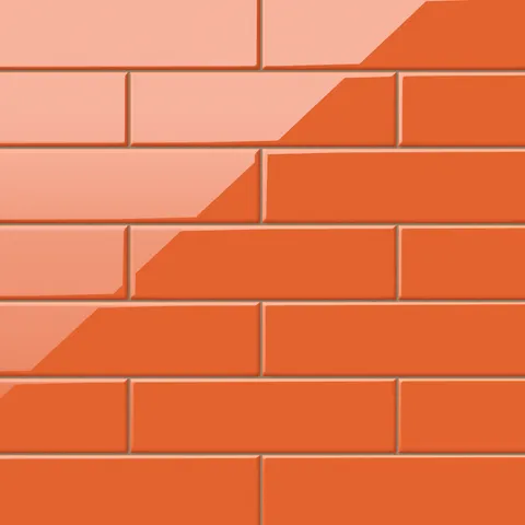 Polly Orange 3x10 glossy ceramic tiles deliver a bold, vibrant tone with a sleek finish, perfect for adding warmth and energy to modern spaces.