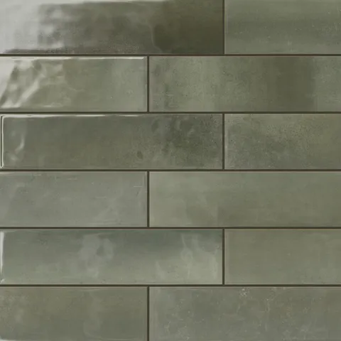 Glossy green subway tiles with a rich, natural tone, perfect for creating a tranquil and stylish design in any interior space.