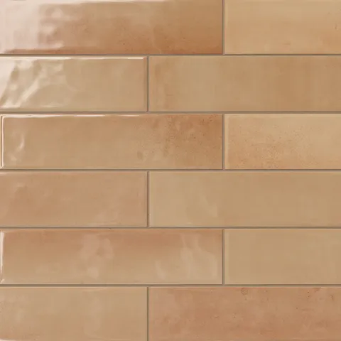 These vibrant 4x16 orange subway tiles, featuring a glossy finish and subtle tonal shifts, add a cozy yet stylish touch to contemporary or rustic interiors.