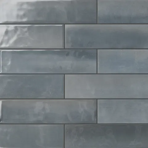 A sleek reflective surface and deep blue tones make these glossy 4x16 subway tiles a perfect choice for adding serenity and sophistication to modern interiors.