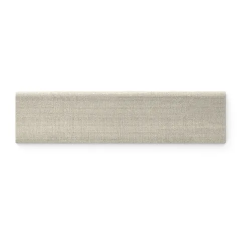 The 3x12 taupe bullnose tile combines a linen pattern with a matte finish, providing a smooth, refined trim that enhances the beauty of any elegant interior.