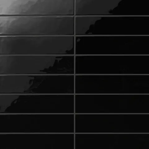 Madilyn 3x12 glossy ceramic tile in deep midnight black, offering a sleek and dramatic finish for bold interior designs.