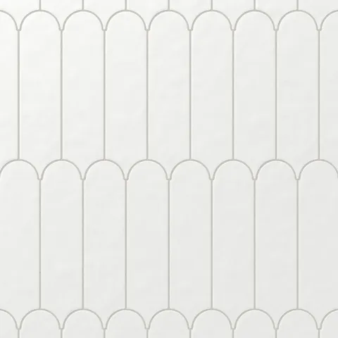 These smooth matte white fishscale tiles bring a soft elegance to interiors, offering a timeless design that pairs seamlessly with any décor.