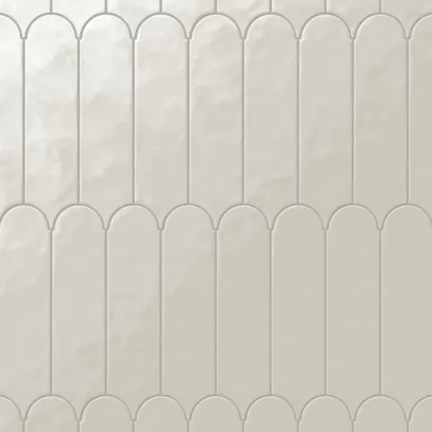 These 3x12 glossy beige tiles, adorned with a delicate fishscale pattern, evoke a soft, timeless elegance, making them a perfect choice for light-filled, airy spaces.