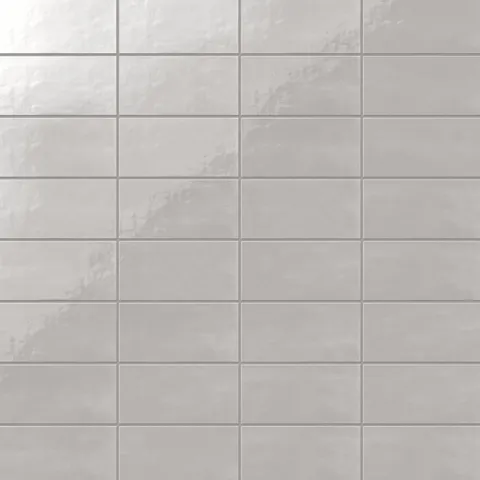3x6-inch fog gray glossy ceramic subway tile featuring a smooth finish and clean grid alignment