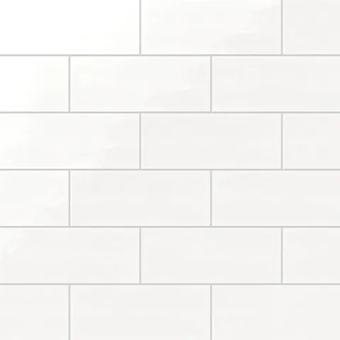 Soft pearl white 4x10-inch glossy ceramic tiles arranged in a clean subway pattern for a sleek, timeless aesthetic
