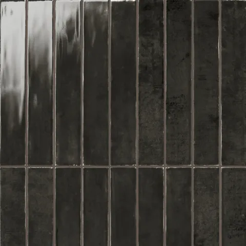 Deep charcoal gloss tile in a sleek 2.5x16 size, offering a polished, modern aesthetic with subtle texture for versatile wall designs.