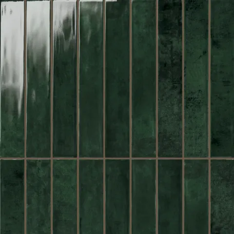 Deep forest green Jaden Hunter 2.5x16 glossy ceramic tiles, featuring a rich, reflective surface and subtle tonal variations for a dramatic and luxurious design statement.