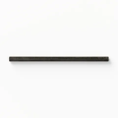 Refined Jaden Ink 0.75x16 pencil tile in a sleek glossy finish, delivering a bold, dark accent for sophisticated design projects.