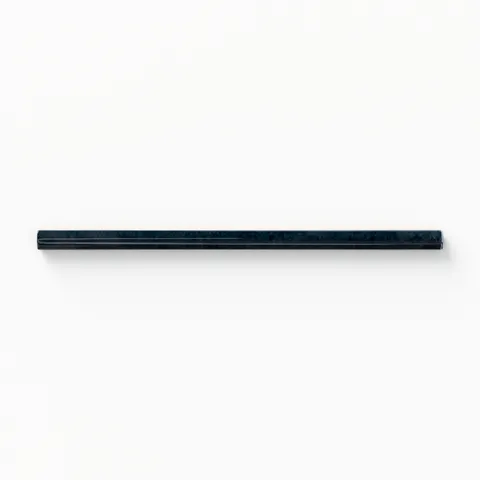 Jaden Navy 0.75x16 pencil tile in a sleek gloss finish, showcasing a deep blue hue perfect for adding a bold and sophisticated touch to any design.