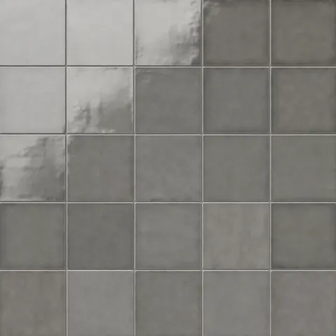 Mikayla 5x5 square ceramic tiles in a muted gray hue, featuring subtle tonal variations and a smooth, glossy finish