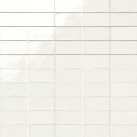 Mikayla soft white ceramic subway tiles with a glossy sheen, offering a versatile and elegant look for timeless interiors