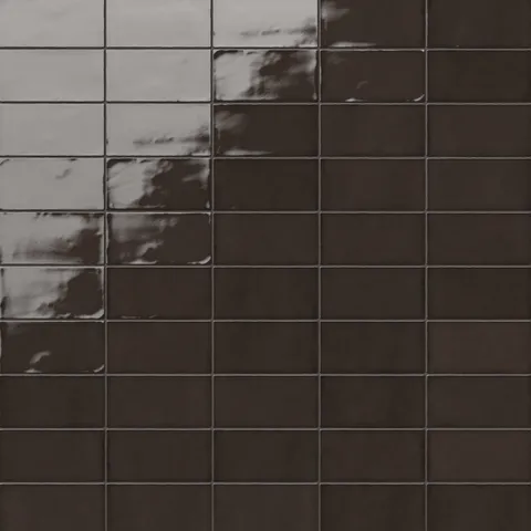 Mikayla dark brown ceramic subway tiles with a rich glossy finish, perfect for adding warmth and depth to any space