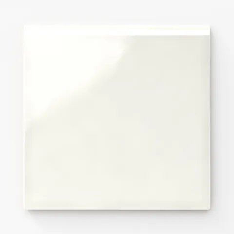 Mikayla ceramic square bullnose tile in soft white, showcasing a glossy surface with subtle reflective highlights
