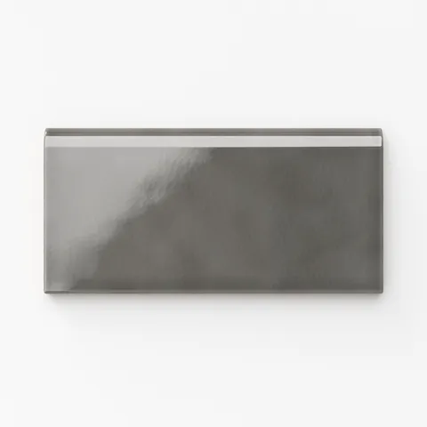 Mikayla ceramic bullnose tile in a smoky gray hue with a subtle glossy finish, perfect for sophisticated modern spaces