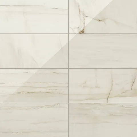 Kendrick Sand 12x24 tile in a polished finish, showcasing warm beige tones with delicate veining for a sleek and sophisticated appearance.