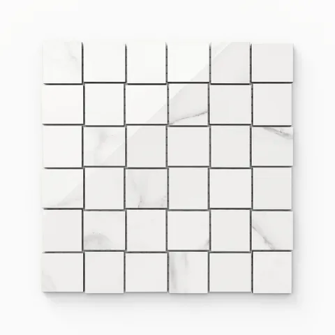 Julianna Carrara 2x2 polished mosaic tiles with soft gray veining, offering a classic marble aesthetic in a versatile format.