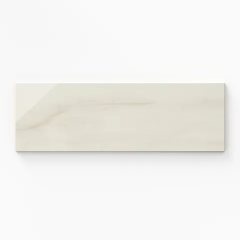 Kendrick Sand 4x12 bullnose tile in a gloss finish, featuring soft beige tones and a sleek edge for a refined and versatile design.