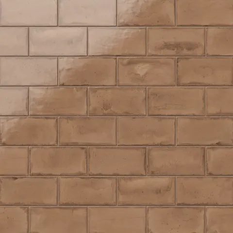 Rich brown glossy ceramic subway tiles in a 3x6 format, showcasing a warm, artisanal finish with subtle texture variations