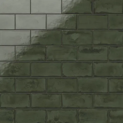 Deep moss-green glossy ceramic subway tiles in a 3x6 format with subtle tonal variations, offering a rich handmade finish for walls or backsplashes