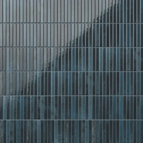 Richly textured Miley porcelain tiles with a glossy finish, exuding deep indigo-blue hues for a bold, elegant statement