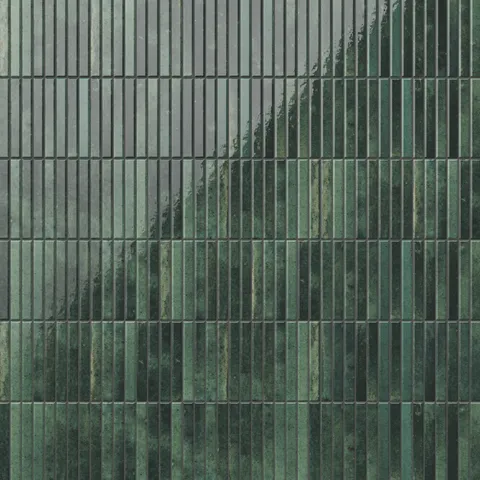 Glossy Miley porcelain tiles in a rich emerald or forest green shade, featuring a vertical linear pattern with natural tonal variations for a striking finish