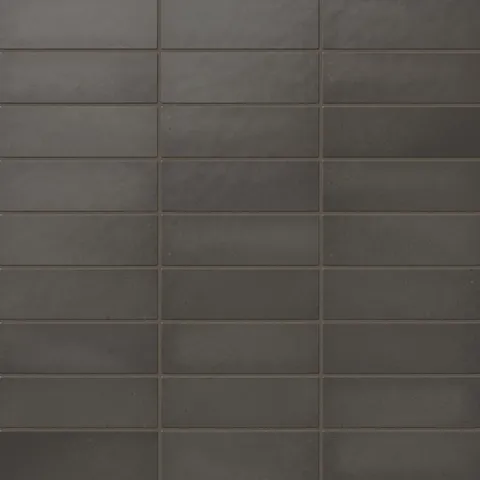 Ellie matte ceramic subway tiles with a rich, dark grayish-brown finish, perfect for bold and modern design applications