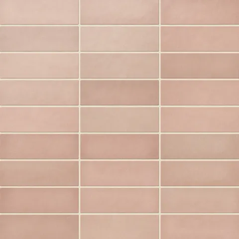 Ellie ceramic subway tiles in a warm matte finish, showcasing soft pink tones for a subtle and elegant design