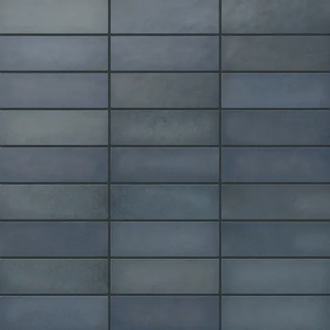 Ellie ceramic subway tiles in a rich matte finish, featuring deep blue hues for a bold and contemporary look