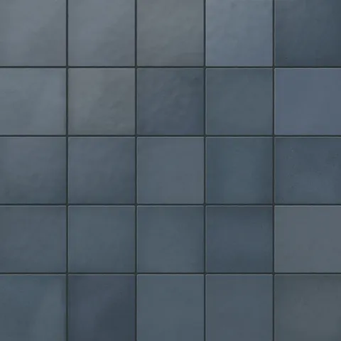 Ellie matte ceramic square tiles in deep blue hues, offering a bold and sophisticated look for walls or floors