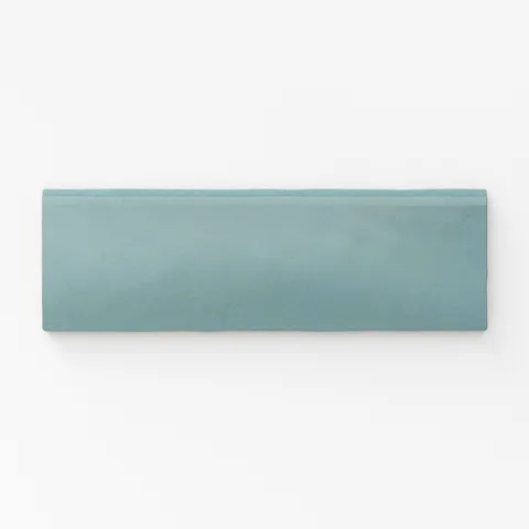 Soft teal bullnose tile with a matte finish, offering a smooth edge for seamless transitions